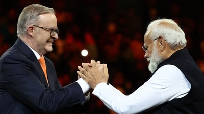 Prime Minister Narendra Modi (R) and Australia's Prime Minister Anthony Albanese gesture during an event with members of the local Indian community at the Qudos Arena in Sydney (AFP) Prime Minister Narendra Modi (R) and Australia's Prime Minister Anthony Albanese gesture during an event with members of the local Indian community at the Qudos Arena in Sydney (AFP)