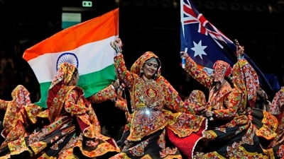 Dancers wave Australian and Indian national flag as they perform ahead of Indian Prime Minister Narendra Modi's arrival to attend a community event at Qudos Bank Arena in Sydney. (AP) Dancers wave Australian and Indian national flag as they perform ahead of Indian Prime Minister Narendra Modi's arrival to attend a community event at Qudos Bank Arena in Sydney. (AP)