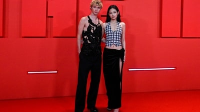 Australian actor and singer Troye Sivan poses with K-Pop singer and actor Jennie during the photo call for The Idol. While Jennie wore a monochrome check-printed waist-coat style blouse and a thigh-high slit black skirt, Troye complemented her in a cut-out top and flared black pants. (AFP) Australian actor and singer Troye Sivan poses with K-Pop singer and actor Jennie during the photo call for The Idol. While Jennie wore a monochrome check-printed waist-coat style blouse and a thigh-high slit black skirt, Troye complemented her in a cut-out top and flared black pants. (AFP)