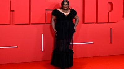 Da'Vine Joy Randolph made heads turn at The Idol after-party in a sensational black gown featuring a plunging V neckline, ruffled embellishments on the bodice and hem, a see-through skirt, and a figure-skimming fitting. Bold red lips, a messy hairdo and high heels added the oomph factor to the look. (AFP) Da'Vine Joy Randolph made heads turn at The Idol after-party in a sensational black gown featuring a plunging V neckline, ruffled embellishments on the bodice and hem, a see-through skirt, and a figure-skimming fitting. Bold red lips, a messy hairdo and high heels added the oomph factor to the look. (AFP)