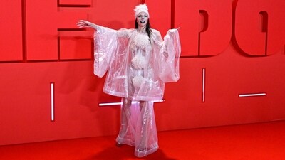 Pop culture icon and model Julia Fox chose to bare it all at The Idol after-party event. She chose an oversized see-through top adorned with fur ball embellishments for the occasion. Matching pants, heels, bold black lip shade, striking makeup, and a quirky cap rounded it off. (AFP) Pop culture icon and model Julia Fox chose to bare it all at The Idol after-party event. She chose an oversized see-through top adorned with fur ball embellishments for the occasion. Matching pants, heels, bold black lip shade, striking makeup, and a quirky cap rounded it off. (AFP)
