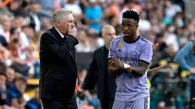 Real Madrid's Italian coach Carlo Ancelotti (L) talks to Real Madrid's Brazilian forward Vinicius Junior (AFP) Real Madrid's Italian coach Carlo Ancelotti (L) talks to Real Madrid's Brazilian forward Vinicius Junior (AFP)