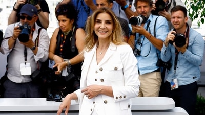 Le Theoreme de Marguerite (Marguerite's Theorem) cast member Clotilde Courau smiled and posed for the paparazzi. She opted for a white outfit. The movie is part of Special Screenings - Cannes. (REUTERS) 