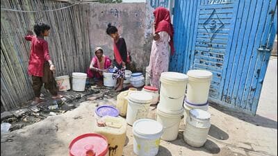 People fill water from a roadside tap on a hot summer day at Old MG Road, in Gurugram on Tuesday. (Parveen Kumar/HT) People fill water from a roadside tap on a hot summer day at Old MG Road, in Gurugram on Tuesday. (Parveen Kumar/HT)