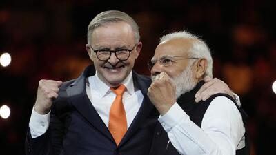 Prime Minister Narendra Modi and his Australian counterpart Anthony Albanese during an Indian community event at Qudos Bank Arena in Sydney. (AP) Prime Minister Narendra Modi and his Australian counterpart Anthony Albanese during an Indian community event at Qudos Bank Arena in Sydney. (AP)