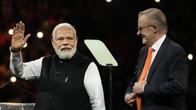 Prime Minister Narendra Modi and his Australian counterpart Anthony Albanese at an Indian community event at Qudos Bank Arena in Sydney on May 23 (AP)