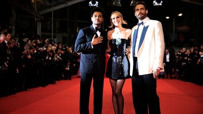 Canadian singer Abel Makkonen Tesfaye aka The Weeknd, French-US actor Lily-Rose Depp, US director Sam Levinson and other stars attended the Cannes Film Festival for the screening of their new drama series The Idol. The picture shows Abel dressed in a sleek tuxedo and Lily looking stunning in a strapless embellished mini dress and sheer stockings. (AFP) Canadian singer Abel Makkonen Tesfaye aka The Weeknd, French-US actor Lily-Rose Depp, US director Sam Levinson and other stars attended the Cannes Film Festival for the screening of their new drama series The Idol. The picture shows Abel dressed in a sleek tuxedo and Lily looking stunning in a strapless embellished mini dress and sheer stockings. (AFP)