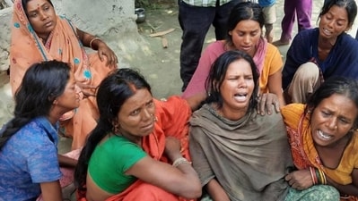 Family members of a hooch tragedy victim in Bihar. Family members of a hooch tragedy victim in Bihar.