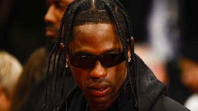 Travis Scott posed for the camera at the 76th Cannes Film Festival for the screening of the series The Idol Out. He was seen in a black outfit. (REUTERS) 