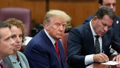 Former President Donald Trump sits at the defense table with his legal team in a Manhattan court, Tuesday. (AP) Former President Donald Trump sits at the defense table with his legal team in a Manhattan court, Tuesday. (AP)