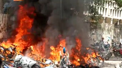 Twenty two-wheelers were gutted as a massive fire broke out outside the parking lot of Lucknow Civil Court, in the Qaiserbagh area of Lucknow, on Tuesday. (HT Photo)