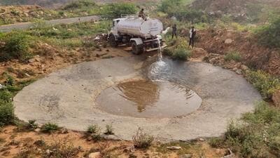 Wildlife department team filling water pits for animals in Aravallis near Sohna village, in Gurugram on Tuesday. (Parveen Kumar/HT) Wildlife department team filling water pits for animals in Aravallis near Sohna village, in Gurugram on Tuesday. (Parveen Kumar/HT)