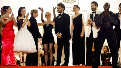 Jennie poses with The Weeknd, Ashley Levinson, Sam Levinson, Troye Sivan, Lily-Rose Depp, Rachel Sennott at the 76th Cannes Film Festival.