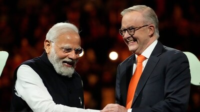 Prime Minister Narendra Modi, left, shakes hands with Australian Prime Minister Anthony Albanese during an Indian community event at Qudos Bank Arena in Sydney, Australia, Tuesday. (AP) Prime Minister Narendra Modi, left, shakes hands with Australian Prime Minister Anthony Albanese during an Indian community event at Qudos Bank Arena in Sydney, Australia, Tuesday. (AP)
