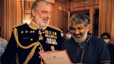 SS Rajamouli (right) with Ray Stevenson on RRR sets. SS Rajamouli (right) with Ray Stevenson on RRR sets.
