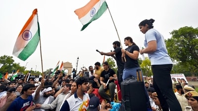 Post the march, Vinesh Phogat confirmed to the media about their Sunday event to hold the 'mahapanchayat' in front of the new Parliament building, the same day it is set to be inaugurated by Prime Minister Narendra Modi. To organise the event, they have not sought any permission from the Delhi police so far. (HT Photo/Sanjeev Verma)