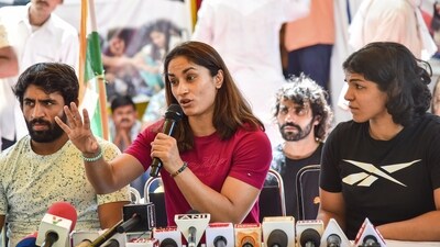 Wrestlers Vinesh Phogat (C), Sakshi Malik and Bajrang Punia during a press conference amid wrestlers protest, at Jantar Mantar in New Delhi. (PTI)