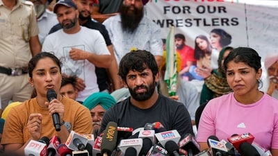 Wrestlers Sakshi Malik, Vinesh Phogat and Bajrang Punia speak with the media during their protest at Jantar Mantar in New Delhi, Monday. (PTI) Wrestlers Sakshi Malik, Vinesh Phogat and Bajrang Punia speak with the media during their protest at Jantar Mantar in New Delhi, Monday. (PTI)