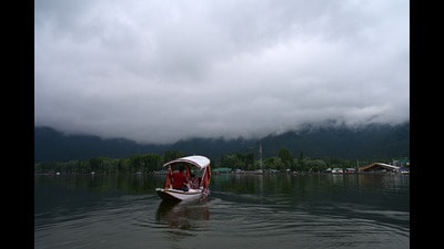 A boatman rows his boat on the Dal Lake in Srinagar on Wednesday. (HT Photo/Waseem Andrabi) A boatman rows his boat on the Dal Lake in Srinagar on Wednesday. (HT Photo/Waseem Andrabi)