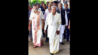 Karnataka chief minister Siddaramaiah, deputy chief minister DK Shivakumar, with Congress MLAs in Bengaluru. (PTI) Karnataka chief minister Siddaramaiah, deputy chief minister DK Shivakumar, with Congress MLAs in Bengaluru. (PTI)