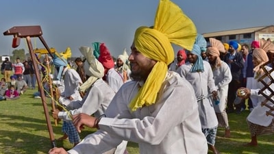 Kila Raipur Rural Olympics, Punjab: This is a local sports event that is held annually between January and February in Kila Raipur. This extravaganza includes a bull cart race, mule cart race, horse cart race, kabaddi, shot put, tug of war, 100mts-1500mts race, high and long jump, and race between tractors. Other unusual activities that take place during this festival include lifting bicycles or ladders with teeth; pulling cars with hair, teeth or ears; and other daredevil stunts on bikes and horses.&nbsp; (HT Photo/Gurpreet Singh)
