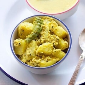 Aloo Posto is a simple yet flavorful Bengali dish made with potatoes cooked in a paste of ground poppy seeds. (Pinterest) Aloo Posto is a simple yet flavorful Bengali dish made with potatoes cooked in a paste of ground poppy seeds. (Pinterest)