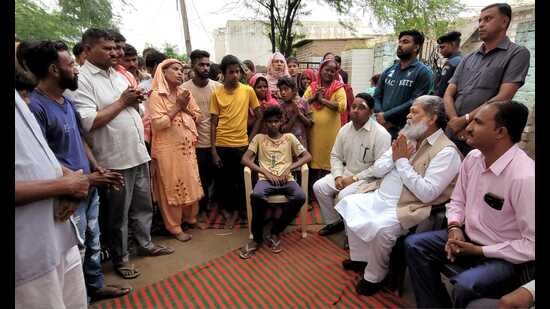 Haryana home minister interacts with families of victims in Ambala on Wednesday.