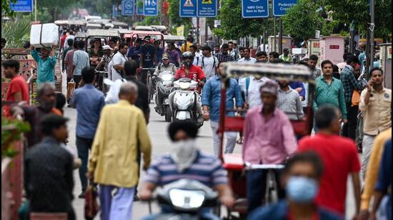 The ban on motor vehicles remains in place, but the stretch continues to witness rickshaws lining the streets and vehicles jostling for space with pedestrians. (Sanchit Khanna/HT Photo)