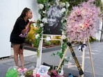 Jessica Rawls of Houston blows a kiss to a portrait of the late singer Tina Turner at her star on the Hollywood Walk of Fame, Wednesday, May 24, 2023, in Los Angeles. Turner died Tuesday at 83 after a long illness. Rawls said that "if it wasn't for [Turner] I don't know how I would have gotten out of my abusive marriage." AP/PTI(AP05_25_2023_000006B)