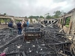 In this photo provided by Guyana's Department of Public Information, the dormitory of a secondary school is burned in Mahdia, Guyana, Monday, May 22, 2023. A nighttime fire raced through the dormitory early Monday, killing at least 19 students and injuring several others, authorities said. In this photo provided by Guyana's Department of Public Information, the dormitory of a secondary school is burned in Mahdia, Guyana, Monday, May 22, 2023. A nighttime fire raced through the dormitory early Monday, killing at least 19 students and injuring several others, authorities said.