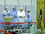 North Korean leader Kim Jong Un (top, 2nd R) and his daughter, presumed to be named Ju Ae (top, R), meeting with the Non-permanent Satellite Launch Preparatory Committee and inspecting a military reconnaissance satellite, at an undisclosed location in North Korea.