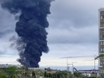 Smoke rises over a fuel tank following an alleged drone attack.