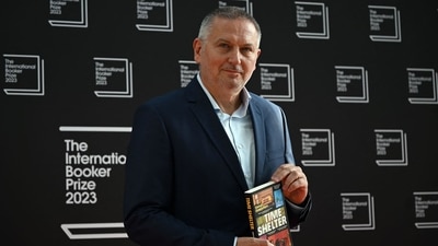 Bulgarian author Georgi Gospodinov poses with his book Time Shelter on the red carpet upon arrival for the International Booker Prize award ceremony. (AFP) Bulgarian author Georgi Gospodinov poses with his book Time Shelter on the red carpet upon arrival for the International Booker Prize award ceremony. (AFP)