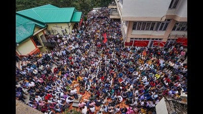 Himachal Pradesh State Electricity Board (HPSEB) employees stage a protest demanding restoration of the old pension scheme, in Shimla on Thursday. (PTI)