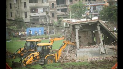 Illegal structures being demolished in Patna’s Nepali Nagar in July 2022. (HT Photo) Illegal structures being demolished in Patna’s Nepali Nagar in July 2022. (HT Photo)