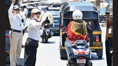 Mumbai, India - May 25, 2023: A traffic warden controls traffic near Rajendra Nagar, at Borivali (East), in Mumbai, India, on Thursday, May 25, 2023. (Photo by Vijay Bate/HT Photo) (HT PHOTO)