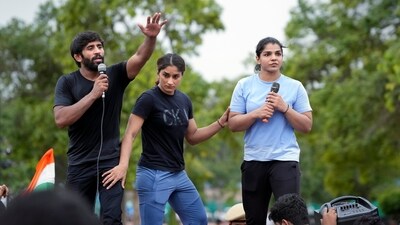 Vinesh Phogat, Sakshi Malik and Bajrang Punia (PTI) Vinesh Phogat, Sakshi Malik and Bajrang Punia (PTI)