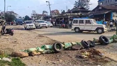A road wears a partially deserted look after a fresh violence, in Kangkopki district of Manipur, Tuesday. (PTI) A road wears a partially deserted look after a fresh violence, in Kangkopki district of Manipur, Tuesday. (PTI)