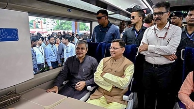 Railways Minister Ashwini Vaishnaw and Uttarakhand chief minister Pushkar Singh Dhami take a ride in newly flagged-off Delhi-Dehradun Vande Bharat Express train, in Dehradun, Thursday, May 25, 2023. (PTI) Railways Minister Ashwini Vaishnaw and Uttarakhand chief minister Pushkar Singh Dhami take a ride in newly flagged-off Delhi-Dehradun Vande Bharat Express train, in Dehradun, Thursday, May 25, 2023. (PTI)