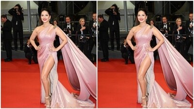 Sunny looked every bit gorgeous in the satin cut out gown with wrap details and a thigh high slit, featuring a broach at the shoulders, cascading to a long train. (Instagram/@sunnyleone) Sunny looked every bit gorgeous in the satin cut out gown with wrap details and a thigh high slit, featuring a broach at the shoulders, cascading to a long train. (Instagram/@sunnyleone)