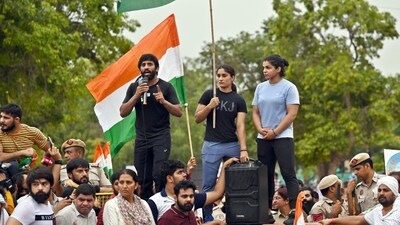 Top wrestlers Vinesh Phogat, Sakshi Malik and Bajrang Punia with supporters during their candlelight protest march (HT Photo/Sanjeev Verma) Top wrestlers Vinesh Phogat, Sakshi Malik and Bajrang Punia with supporters during their candlelight protest march (HT Photo/Sanjeev Verma)