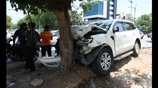 An SUV rammed into a tree near Cheema Boiler Chowk on Airport Road, Mohali, on Thursday morning. (Keshav Singh/HT)