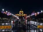 People walk during rains at Kartavya Path, in New Delhi on Thursday. (PTI) People walk during rains at Kartavya Path, in New Delhi on Thursday. (PTI)
