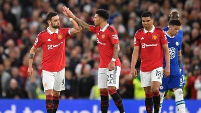 Manchester United's Portuguese midfielder Bruno Fernandes (L) celebrates with striker Jadon Sancho (C) after scoring their third goal and Chelsea (AFP) Manchester United's Portuguese midfielder Bruno Fernandes (L) celebrates with striker Jadon Sancho (C) after scoring their third goal and Chelsea (AFP)