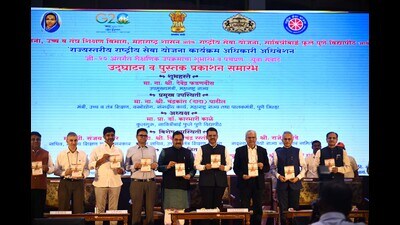 Fadnavis (C) unveils a book during the G20 Education programme in city on Friday. (KALPESH NUKTE/ HT) Fadnavis (C) unveils a book during the G20 Education programme in city on Friday. (KALPESH NUKTE/ HT)