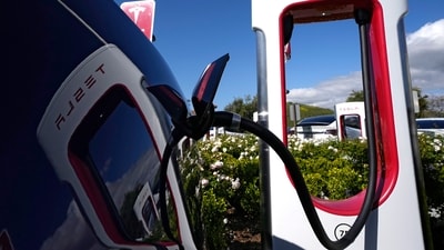All of Ford Motor Co.'s current and future electric vehicles will have access to about 12,000 Tesla Supercharger stations starting in 2024, according to an announcement Thursday, May 25, 2023, by Ford CEO Jim Farley and Tesla CEO Elon Musk. (AP) All of Ford Motor Co.'s current and future electric vehicles will have access to about 12,000 Tesla Supercharger stations starting in 2024, according to an announcement Thursday, May 25, 2023, by Ford CEO Jim Farley and Tesla CEO Elon Musk. (AP)