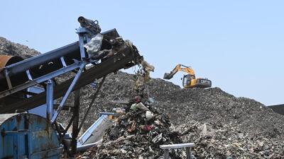 Gurugram, India-May 25, 2023: A Trommel Screen Machine processing legacy waste at a waste treatment plant at Bandhwari, in Gurugram, India, on Thursday, 25 May 2023. The Municipal Corporation of Gurugram (MCG) has decided to impose fine on four companies for delay in processing legacy waste at the site (Photo by Parveen Kumar/Hindustan Times)**To go with Leena's story Gurugram, India-May 25, 2023: A Trommel Screen Machine processing legacy waste at a waste treatment plant at Bandhwari, in Gurugram, India, on Thursday, 25 May 2023. The Municipal Corporation of Gurugram (MCG) has decided to impose fine on four companies for delay in processing legacy waste at the site (Photo by Parveen Kumar/Hindustan Times)**To go with Leena's story