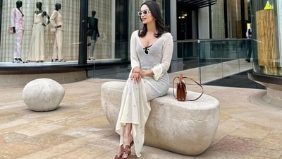 Manushi shared pictures of herself sipping wine and enjoying Monaco with the caption, "A day in Monaco." It shows the star dressed in a semi-sheer dress. The summer-ready ensemble features a see-through cream overlay, black mini-length lining, pretty embellishments, and a figure-skimming silhouette. Stylish sunnies, statement earrings, a sleek bracelet, open locks, and minimal makeup gave the finishing touch. (Instagram) Manushi shared pictures of herself sipping wine and enjoying Monaco with the caption, "A day in Monaco." It shows the star dressed in a semi-sheer dress. The summer-ready ensemble features a see-through cream overlay, black mini-length lining, pretty embellishments, and a figure-skimming silhouette. Stylish sunnies, statement earrings, a sleek bracelet, open locks, and minimal makeup gave the finishing touch. (Instagram)