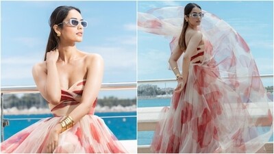Manushi styled the ensemble with stacked gold bracelets, statement rings, heart-shaped ear studs, and stilettos. Lastly, a centre-parted half-tied hairdo, Prada sunglasses, minimal makeup, and glossy pink lip shade rounded it off. (Instagram) Manushi styled the ensemble with stacked gold bracelets, statement rings, heart-shaped ear studs, and stilettos. Lastly, a centre-parted half-tied hairdo, Prada sunglasses, minimal makeup, and glossy pink lip shade rounded it off. (Instagram)