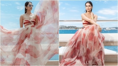 Earlier, Manushi had posted pictures from her press photo call in Cannes. She wore a floral printed strapless gown from the shelves of the designer label Gauri & Nainika. The gown features a plunge neck, flowy tulle layered skirt, and a floor-grazing hem length. (Instagram) Earlier, Manushi had posted pictures from her press photo call in Cannes. She wore a floral printed strapless gown from the shelves of the designer label Gauri & Nainika. The gown features a plunge neck, flowy tulle layered skirt, and a floor-grazing hem length. (Instagram)